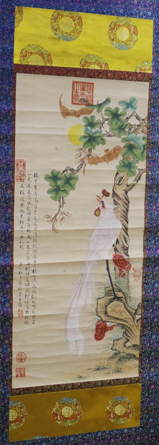 A Chinese scroll painting of a phoenix in a landscape